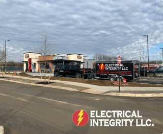 Electrical Integrity truck in front of raising canes for a commercial job